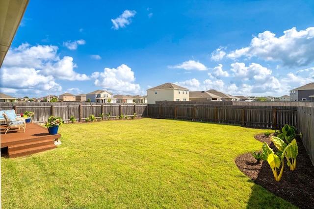 121 Rubrum Rd, Kyle, TX 78640 - fenced backyard with a residential view and a wooden deck