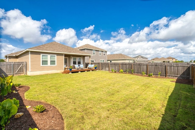 121 Rubrum Rd, Kyle, TX 78640 - back of property featuring outdoor lounge area, a fenced backyard, and a wooden deck