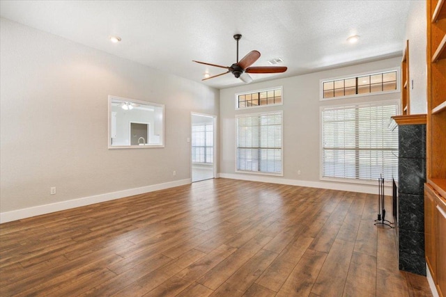 3609 Walter Ln, Belton, TX 76513 - unfurnished living room featuring a ceiling fan, a fireplace, dark wood finished floors, baseboards, and recessed lighting