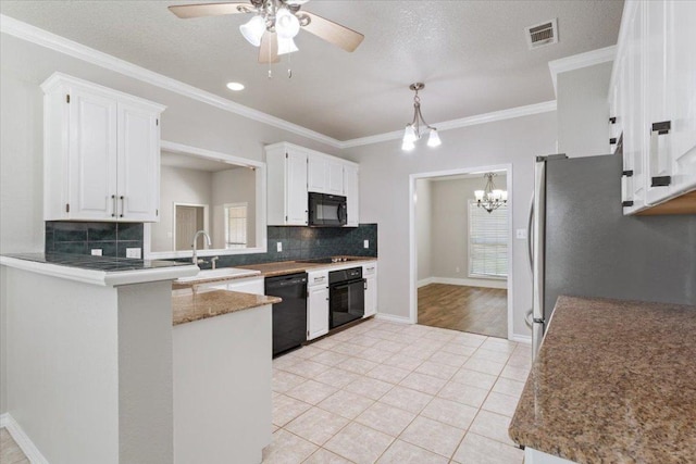 3609 Walter Ln, Belton, TX 76513 - kitchen with black appliances, a sink, ceiling fan, white cabinetry, and tasteful backsplash