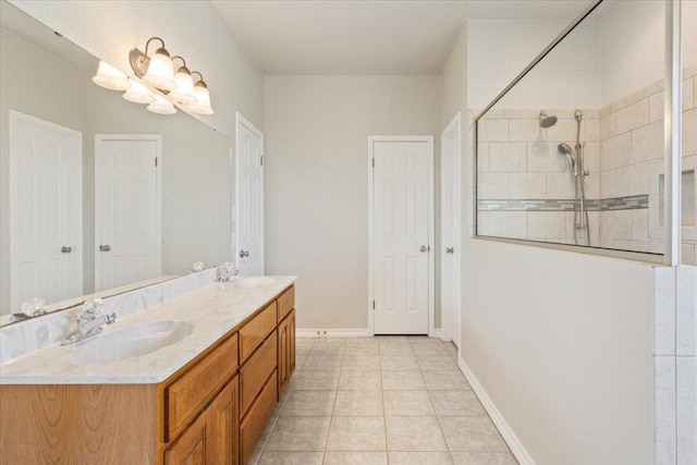 3609 Walter Ln, Belton, TX 76513 - full bath featuring double vanity, walk in shower, tile patterned flooring, and baseboards