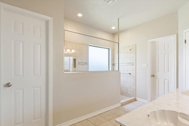 3609 Walter Ln, Belton, TX 76513 - bathroom with a walk in shower, double vanity, baseboards, tile patterned flooring, and recessed lighting