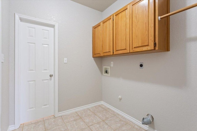 3609 Walter Ln, Belton, TX 76513 - washroom featuring cabinet space, hookup for a washing machine, hookup for an electric dryer, light tile patterned floors, and baseboards