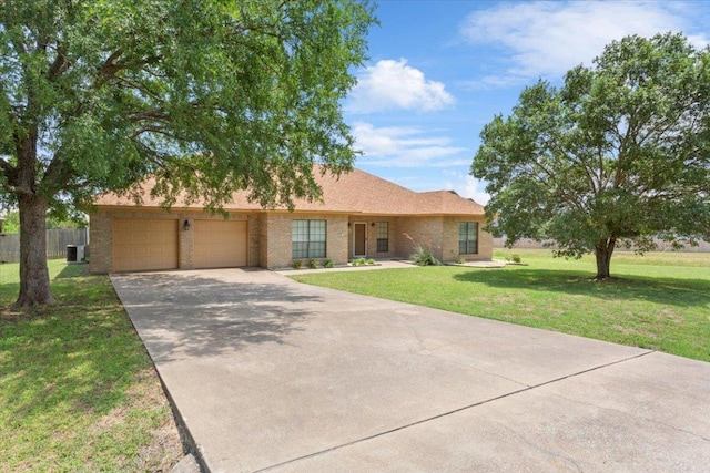3609 Walter Ln, Belton, TX 76513 - single story home featuring a garage, concrete driveway, and brick siding