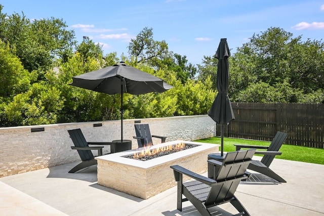 206 Bridge Water Loop, Dripping Springs, TX 78620 - view of patio / terrace with an outdoor fire pit
