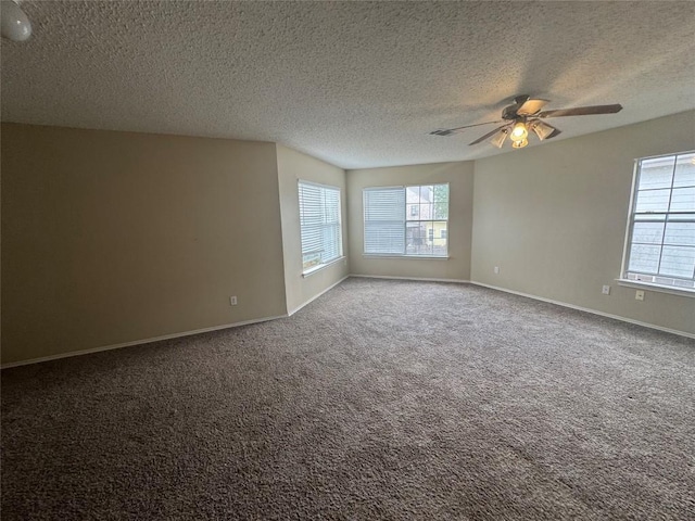 420 Emerald Fields Ln, Kyle, TX 78640 - carpeted empty room with ceiling fan, a textured ceiling, and baseboards