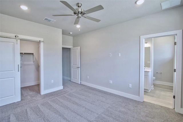5907 Rotunda Vw, Austin, TX 78747 - unfurnished bedroom featuring carpet flooring, a spacious closet, baseboards, recessed lighting, and ensuite bathroom