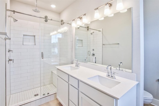 5907 Rotunda Vw, Austin, TX 78747 - full bath with a shower stall, double vanity, toilet, and recessed lighting