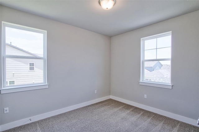 5907 Rotunda Vw, Austin, TX 78747 - carpeted empty room with plenty of natural light and baseboards