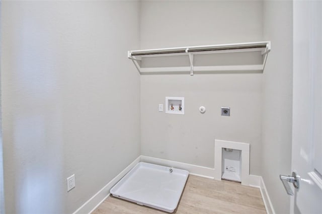 5907 Rotunda Vw, Austin, TX 78747 - laundry room featuring hookup for a gas dryer, hookup for an electric dryer, hookup for a washing machine, wood finished floors, and baseboards