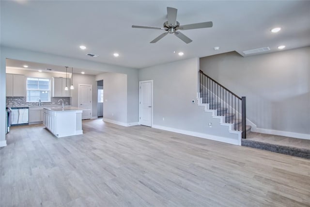 5907 Rotunda Vw, Austin, TX 78747 - kitchen with open floor plan, dishwasher, light wood-style floors, baseboards, and recessed lighting