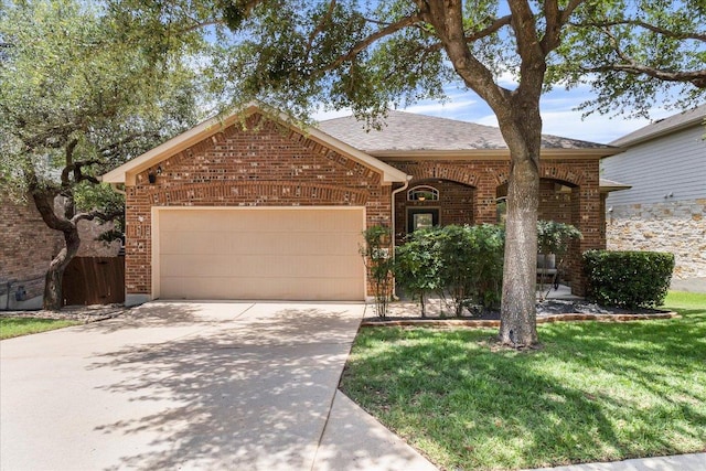 167 Limestone Trl Unit 76, Austin, TX 78737 - view of front of property featuring brick siding, an attached garage, driveway, and roof with shingles