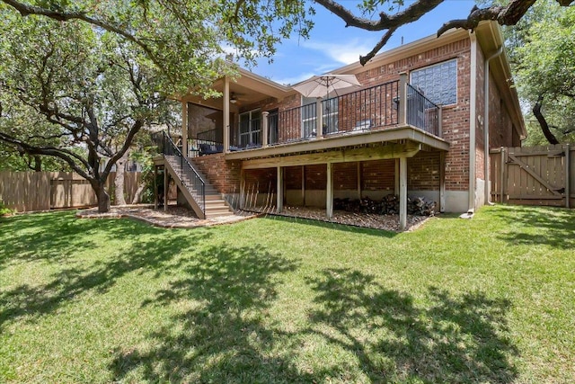 167 Limestone Trl Unit 76, Austin, TX 78737 - back of house with ceiling fan, stairs, a wooden deck, and brick siding