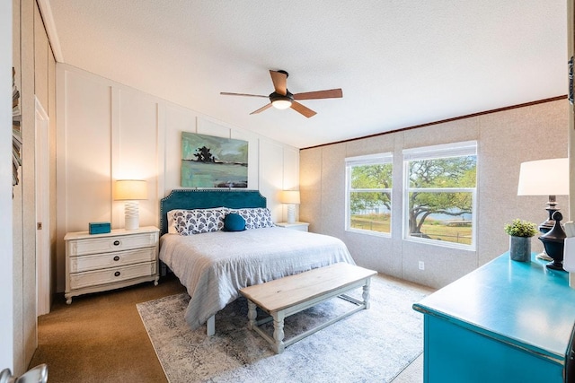 231 Wolf Run, Burnet, TX 78611 - bedroom with dark carpet, lofted ceiling, and a ceiling fan