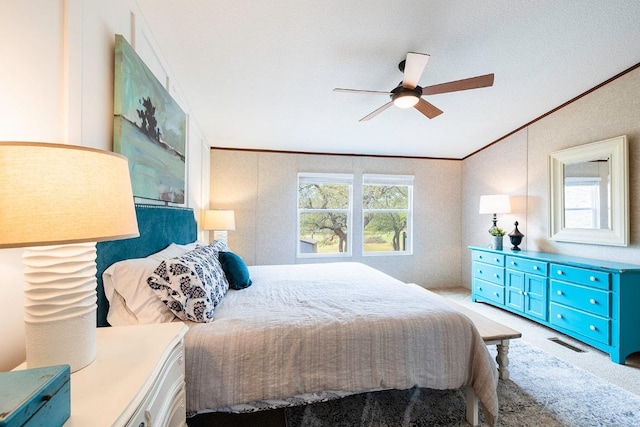 231 Wolf Run, Burnet, TX 78611 - bedroom featuring ornamental molding, light carpet, vaulted ceiling, and a ceiling fan