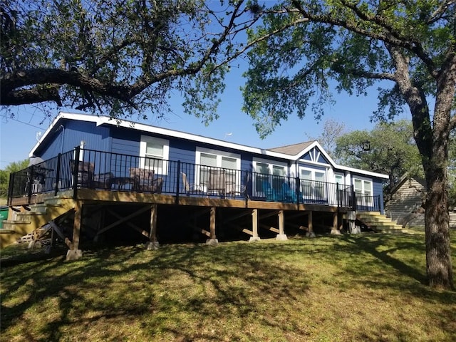 231 Wolf Run, Burnet, TX 78611 - rear view of property with a wooden deck, a lawn, and stairway