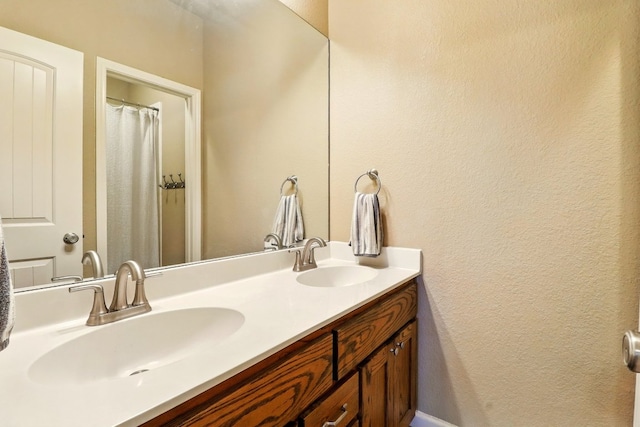 529 Honeycomb Cir, Driftwood, TX 78619 - bathroom with double vanity and a textured wall