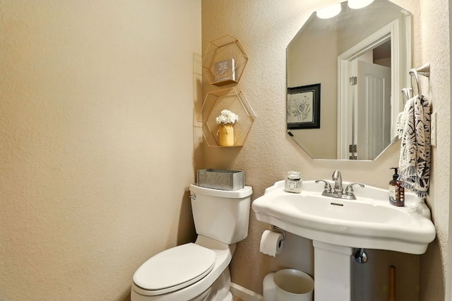 529 Honeycomb Cir, Driftwood, TX 78619 - half bathroom with toilet, a textured wall, and a sink