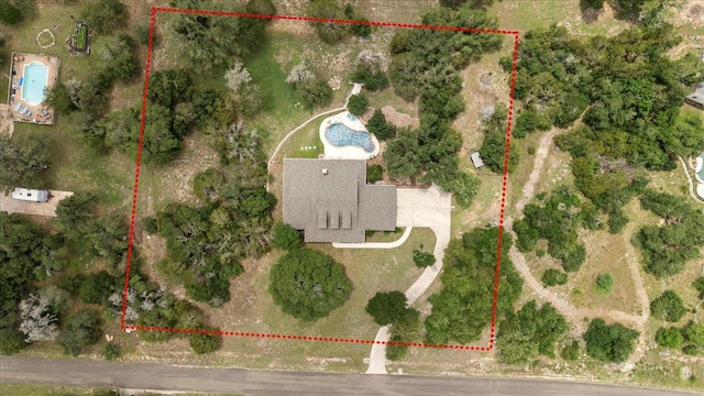 529 Honeycomb Cir, Driftwood, TX 78619 - aerial view of property and surrounding area with property boundaries highlighted and a pool