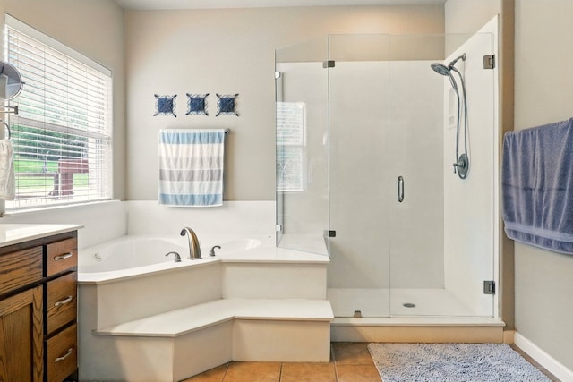 529 Honeycomb Cir, Driftwood, TX 78619 - full bath featuring a stall shower, a garden tub, vanity, and tile patterned floors