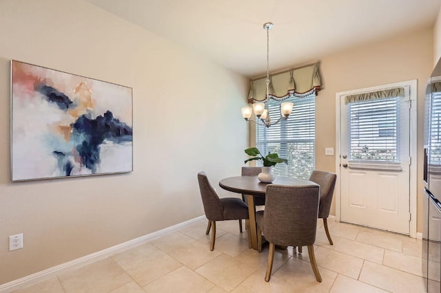 406 Epiphany Ln, Pflugerville, TX 78660 - dining area with a chandelier and light tile patterned flooring