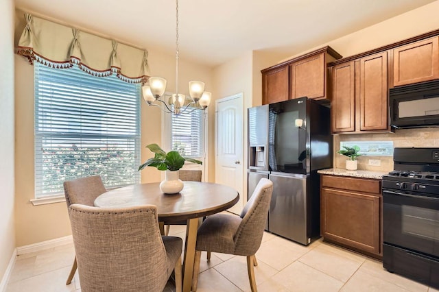 406 Epiphany Ln, Pflugerville, TX 78660 - dining area featuring a chandelier and light tile patterned flooring