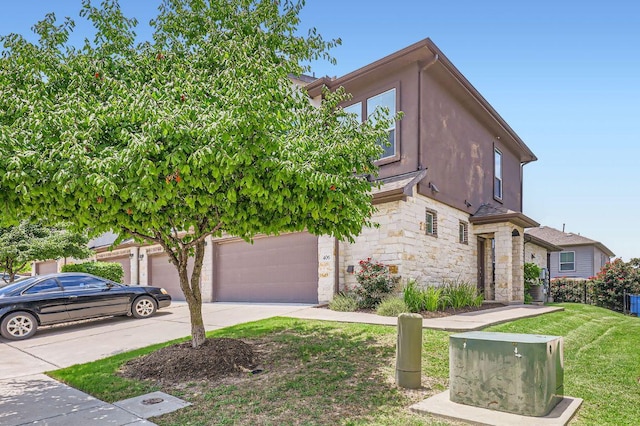 406 Epiphany Ln, Pflugerville, TX 78660 - view of front facade featuring stone siding, concrete driveway, stucco siding, and a front lawn