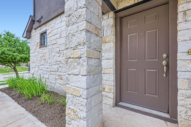 406 Epiphany Ln, Pflugerville, TX 78660 - view of exterior entry with stone siding