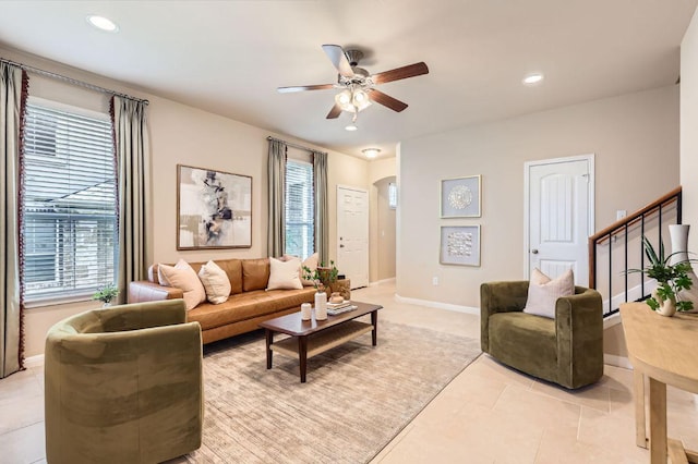 406 Epiphany Ln, Pflugerville, TX 78660 - living area with plenty of natural light, ceiling fan, arched walkways, light tile patterned floors, and recessed lighting