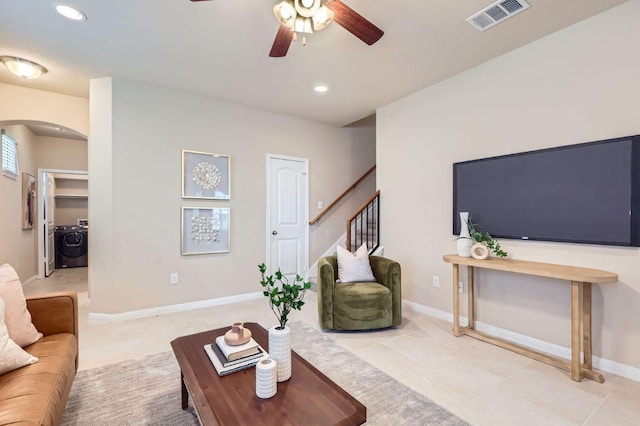 406 Epiphany Ln, Pflugerville, TX 78660 - living area featuring arched walkways, washer / clothes dryer, a ceiling fan, stairs, and recessed lighting