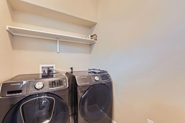406 Epiphany Ln, Pflugerville, TX 78660 - laundry room with washer and dryer and baseboards