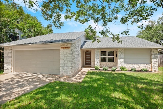 12303 Turtleback Ln, Austin, TX 78727 - view of front facade featuring stone siding, a garage, driveway, a front lawn, and a shingled roof