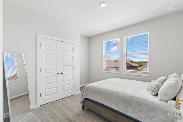 155 Denali Dr, Kyle, TX 78640 - carpeted bedroom with a closet and baseboards