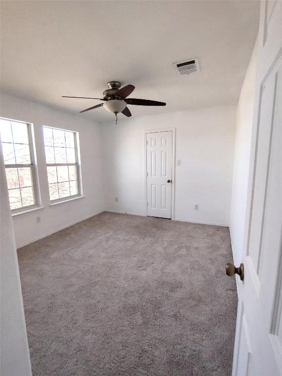 2108 Cottontail Dr, Leander, TX 78641 - spare room with carpet flooring and a ceiling fan