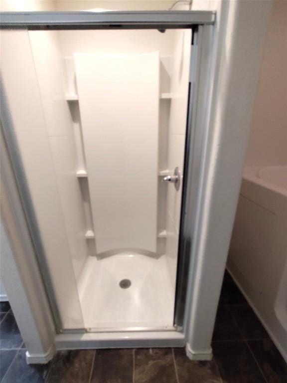 2108 Cottontail Dr, Leander, TX 78641 - bathroom featuring a stall shower and tile patterned floors