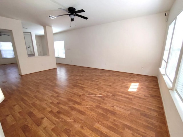 2108 Cottontail Dr, Leander, TX 78641 - unfurnished living room featuring a ceiling fan and wood finished floors