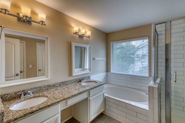 6429 Clay Allison Pass, Austin, TX 78749 - bathroom with a bath, a shower stall, double vanity, and tile patterned floors
