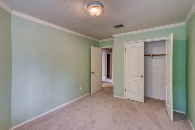 6429 Clay Allison Pass, Austin, TX 78749 - unfurnished bedroom with ornamental molding, light carpet, baseboards, a closet, and a textured ceiling