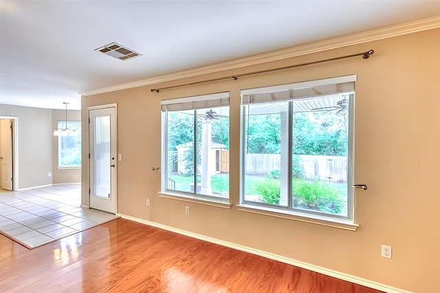 6429 Clay Allison Pass, Austin, TX 78749 - empty room featuring crown molding and wood finished floors