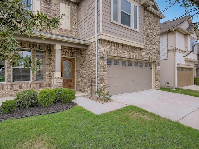 12400 Britannic Dr, Austin, TX 78753 - view of front of home featuring an attached garage, concrete driveway, and a front lawn