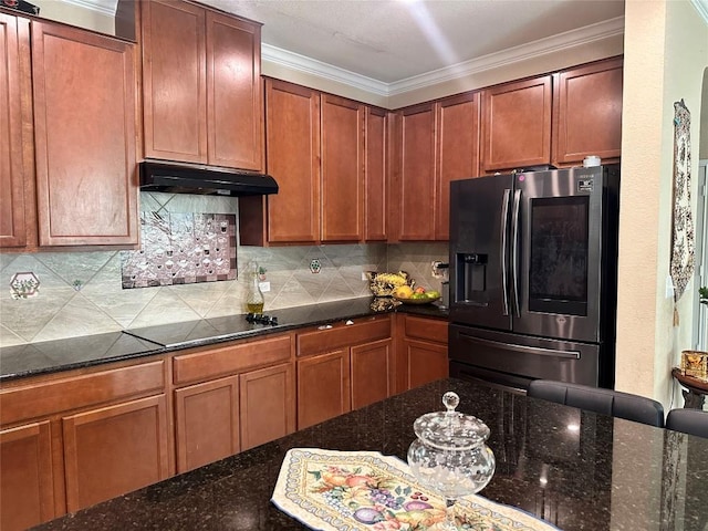 12400 Britannic Dr, Austin, TX 78753 - kitchen with stainless steel refrigerator with ice dispenser, under cabinet range hood, black electric cooktop, tasteful backsplash, and dark stone countertops