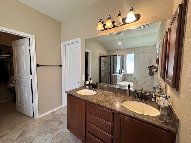 12400 Britannic Dr, Austin, TX 78753 - bathroom with a shower stall, double vanity, a bath, and a walk in closet