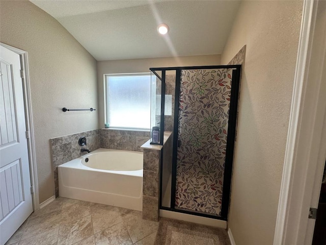 12400 Britannic Dr, Austin, TX 78753 - bathroom with a bath, a shower stall, and a textured wall