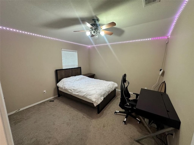 12400 Britannic Dr, Austin, TX 78753 - bedroom with carpet flooring, baseboards, and a ceiling fan