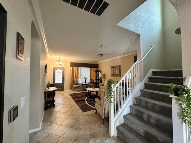 12400 Britannic Dr, Austin, TX 78753 - living area featuring arched walkways, crown molding, stairway, light tile patterned floors, and baseboards