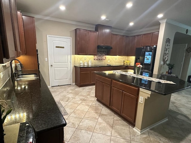 12400 Britannic Dr, Austin, TX 78753 - kitchen with a sink, black refrigerator with ice dispenser, tasteful backsplash, dark stone countertops, and crown molding