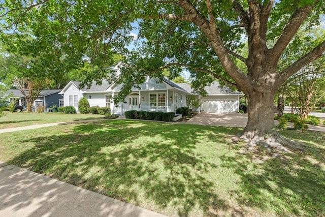 6008 Woodview Ave, Austin, TX 78757 - view of front of property with covered porch, a front yard, and an attached garage