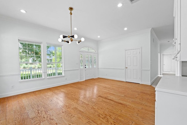 6008 Woodview Ave, Austin, TX 78757 - unfurnished dining area featuring crown molding, recessed lighting, a chandelier, light wood-type flooring, and baseboards