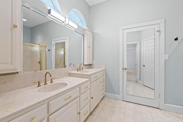 6008 Woodview Ave, Austin, TX 78757 - full bath with vanity, a stall shower, tile patterned flooring, and baseboards