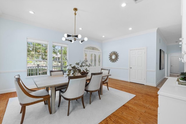 6008 Woodview Ave, Austin, TX 78757 - dining room featuring ornamental molding, a chandelier, light wood-style floors, and recessed lighting